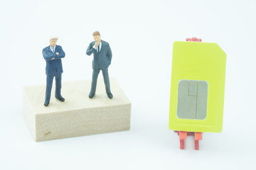 Miniature people two businessman with SIM card for business