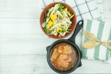 Spicy slice mango salad served with salmon