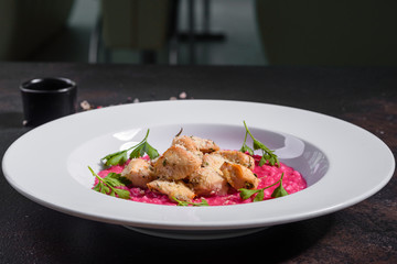 Delicious risotto with roasted pieces of chicken fillet. Risotto with chicken pieces. 