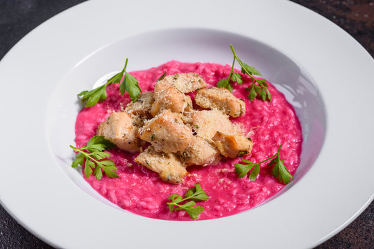 Delicious risotto with roasted pieces of chicken fillet. Risotto with chicken pieces. 