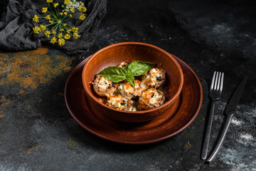 Caps of mushrooms champagne stuffed with four varieties of cheese and baked. Traditional Italian Mushroom Caps stuffed with Feta