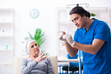 Young male doctor and female oncology patient