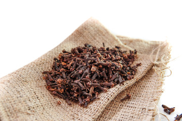 cloves on burlap sacks isolated white background