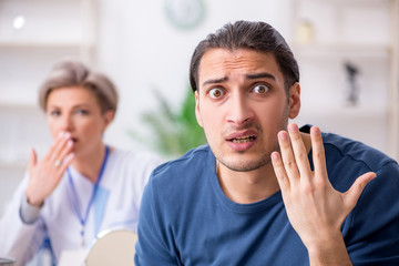 Young patient visiting doctor in hospital