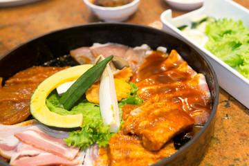 chicken with rice and vegetables in pan
