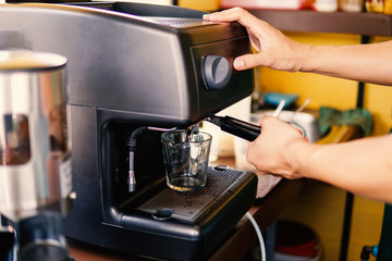 barista steaming coffee