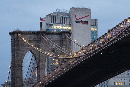 Verizon logo adjacent to the Brooklyn Bridge in Manhattan, New York on September 14, 2019