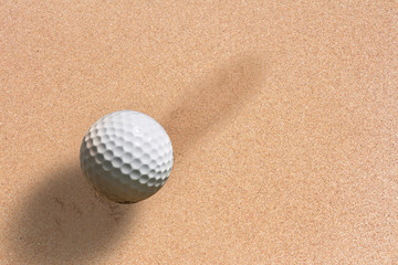 golf ball on sand background