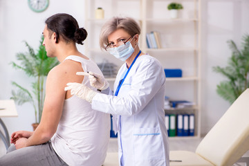 Fototapeta premium Young patient visiting doctor in hospital