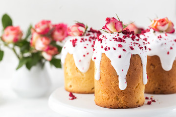 Traditional Easter bread decorated sugar icing, raspberries and flowers