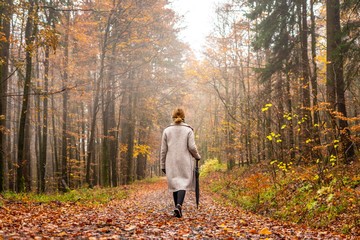 man walking in autumn park