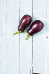 eggplants on shabby chic bright wood table