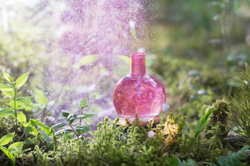 magic potion on bottle in forest
