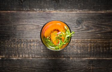 Gin based cocktail with peaches and thyme. Selective focus. Shallow depth of field.