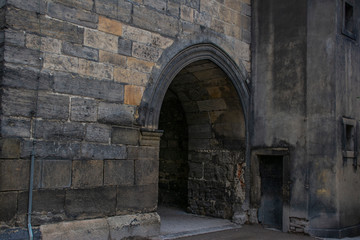 Fototapeta na wymiar Stone passage in an old brick wall