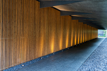 Obraz premium Bottom Lighting of Bamboo Wall Along the Corridor.