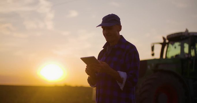 Agriculture Farmer examining field Modern Farming