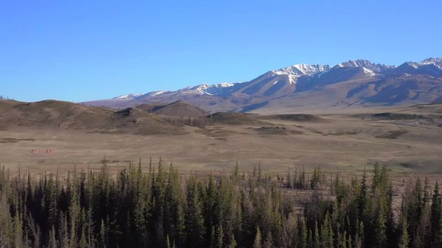 Mountain peaks, blue sky, envirement. Shooting with drone 4K.