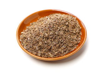 Pile of dill seeds on white background