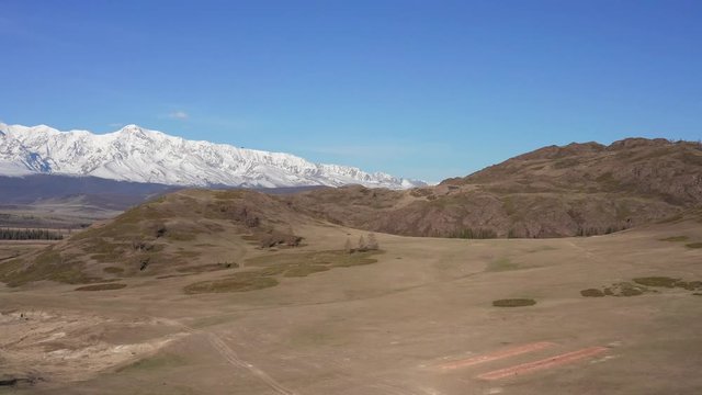 Untitled ProMountain peaks, blue sky, bird, envirement. Shooting with drone 4K.ject