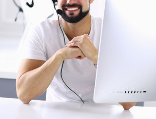 Businessman in the office on the phone with headset, Skype