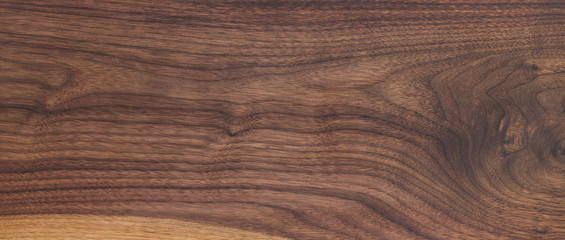 Texture of black walnut board with oil finish