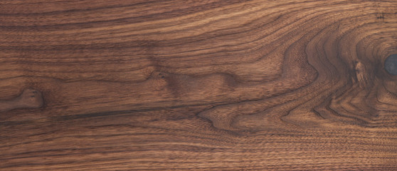 Texture of black walnut board with oil finish