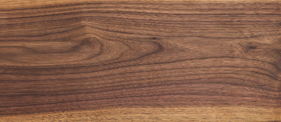 Texture of black walnut board with oil finish