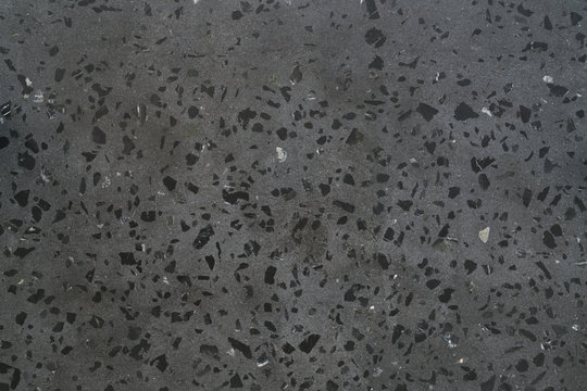 Texture of gray concrete terrazzo with black marble