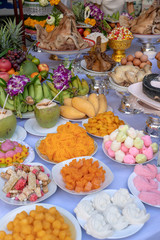 Sacrificial offering food for pray to god and memorial to ancestor, Bangkok, Thailand. Traditional offerings to gods with food, vegetable and fruit for the gods of Thai culture