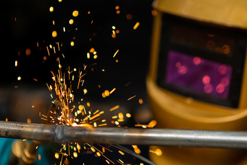welding with workpiece steel. Working welder steel Using electric welding machine safety equipment...