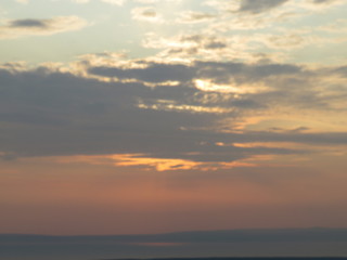 Naklejka na ściany i meble sunset over the sea in the sky