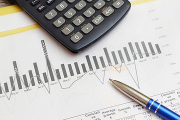 Business concept with a report and a calculator	