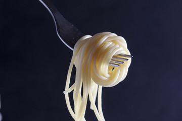 Cooked spaghetti on a fork