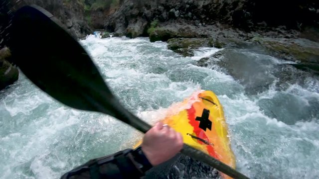 First person view of extreme whitewater kayaker descending class IV+ Takilma Gorge on the upper Rogue River in Southern Oregon.