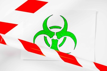 Illustration of a green and white biohazard sign of biological threat alert with signal tape on the wall