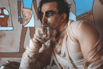 Halloween costume and makeup concept, Caucasian man looks like muscular African ethnic