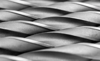 Abstract background of metal drill bits. Macrophoto.