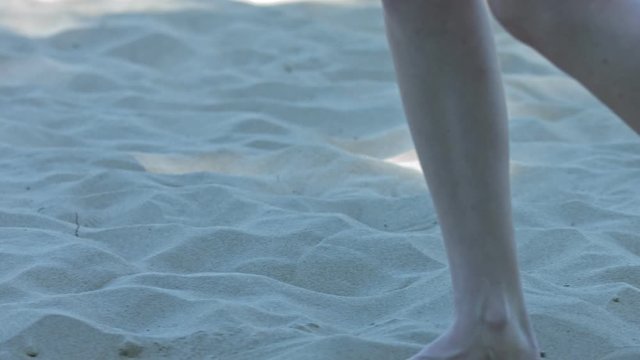 Slow Motion of Beautiful Woman barfoot feet with light skin Walk On The Beach on holiday. Close Up Shot.