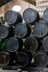Production of fortified jerez, xeres, sherry wines in old oak barrels in sherry triangle, Jerez la Frontera, El Puerto Santa Maria and Sanlucar Barrameda Andalusia, Spain