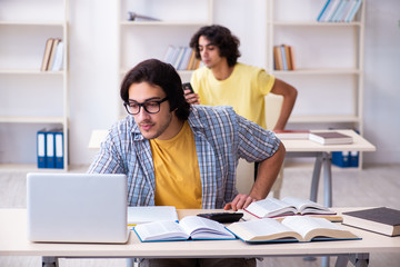 Two male students in the classroom