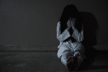 Horror woman ghost creepy sitting on wall her is scary and cry,