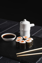 Japanese sushi on black stone background