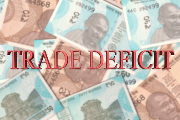 Word Trade Deficit In 3d letters on Indian Currency Banknotes