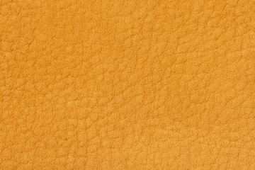 Fototapeta premium Genuine leather texture, for background, bright yellow color. Modern background, backdrop