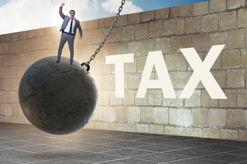 Businessman in tax return submission concept