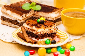 Tiramisu dish with cinnamon and candies