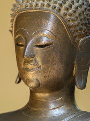 Close-up side face of bronze buddha statue, Lan Xang Style Art 17th Century.