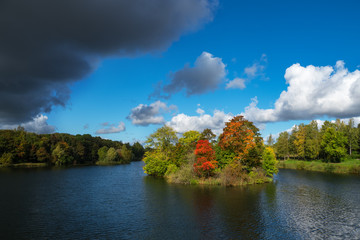 A dark cloud on a clear autumn day.