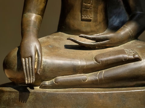 Close-up Hand And Legs Of Bronze Seated Buddha Statue, Lan Xang Style Art 17th Century.